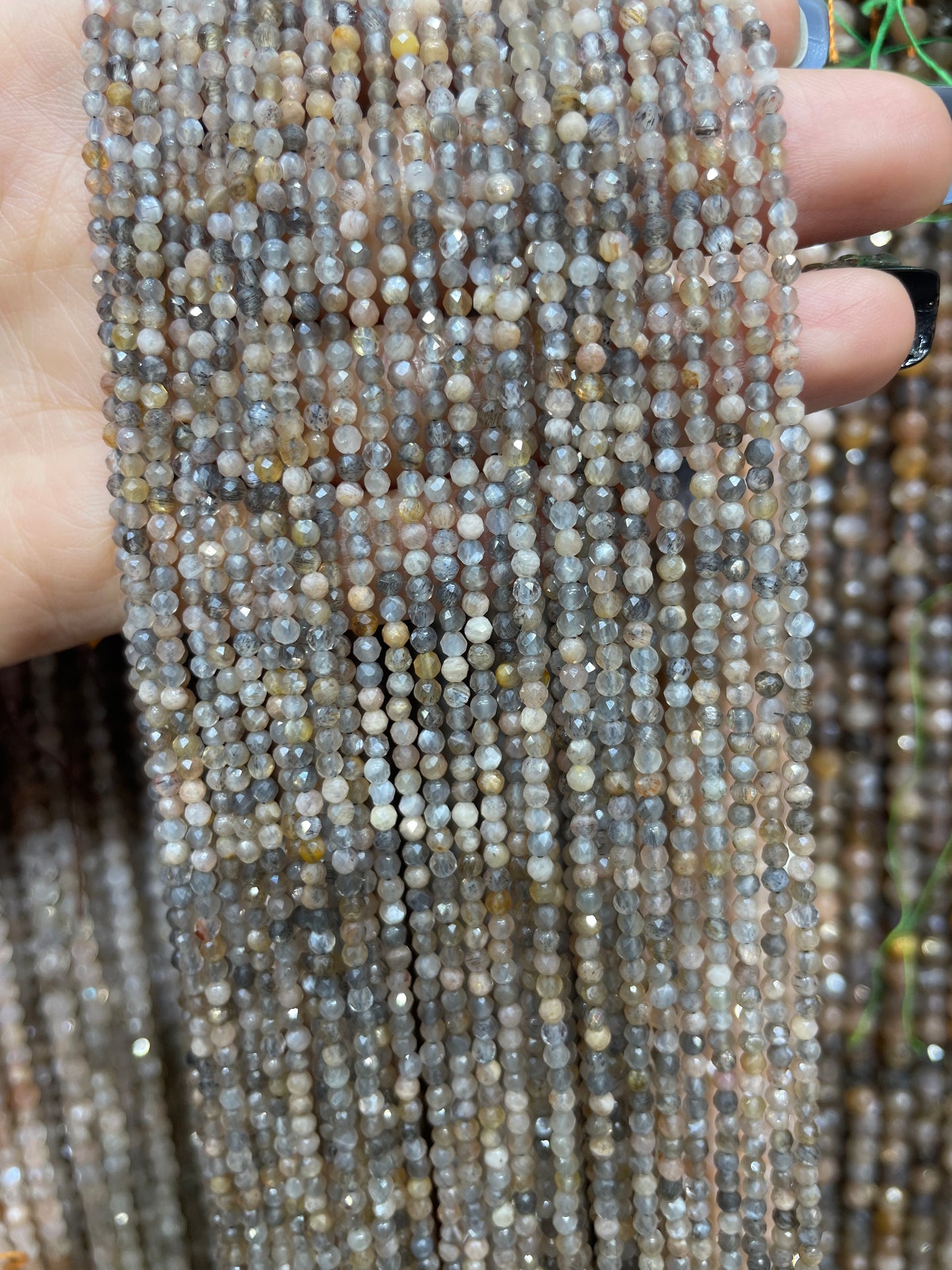 faceted black skeleton sunstone strand 2mm