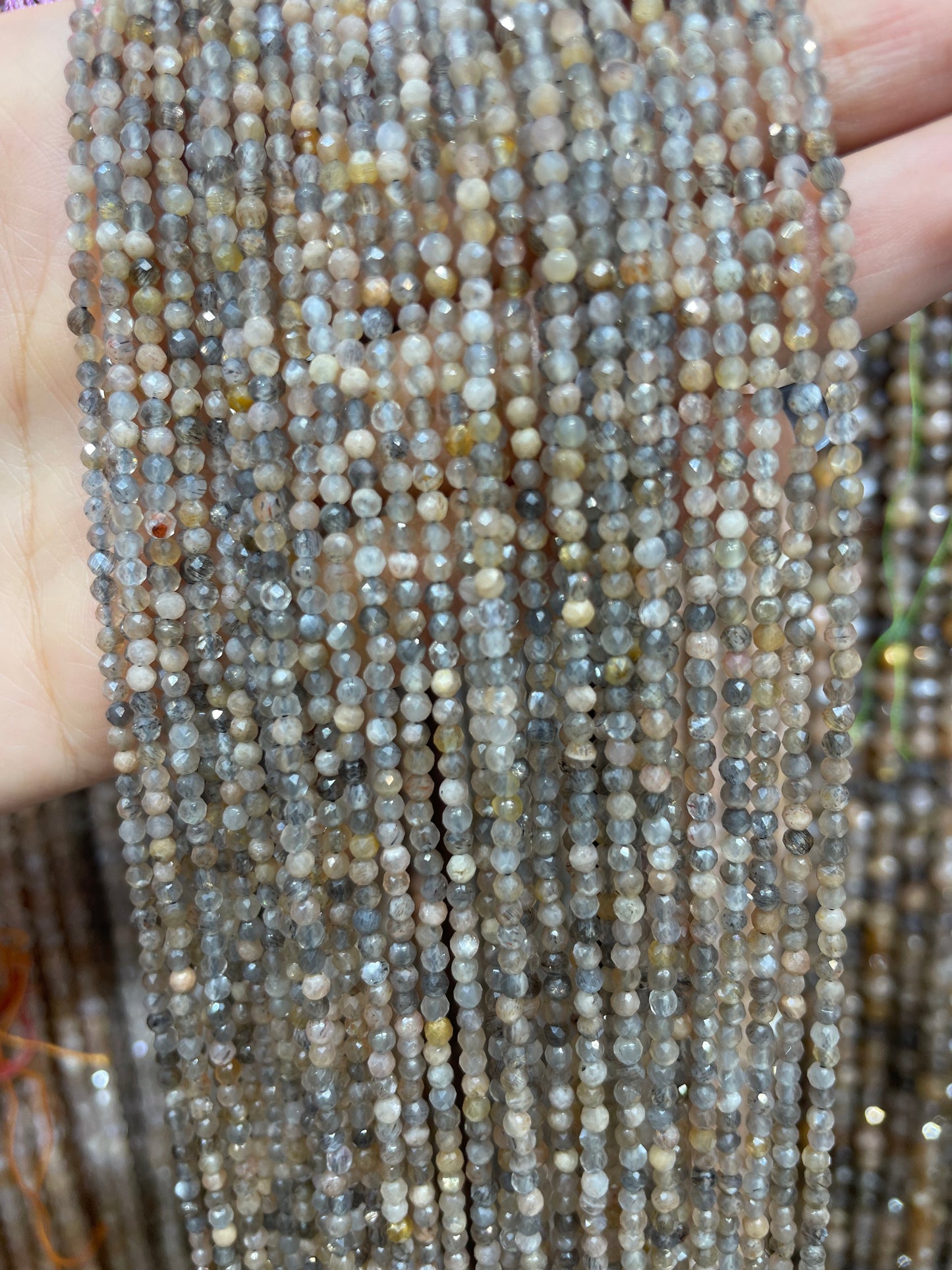 faceted black skeleton sunstone strand 2mm