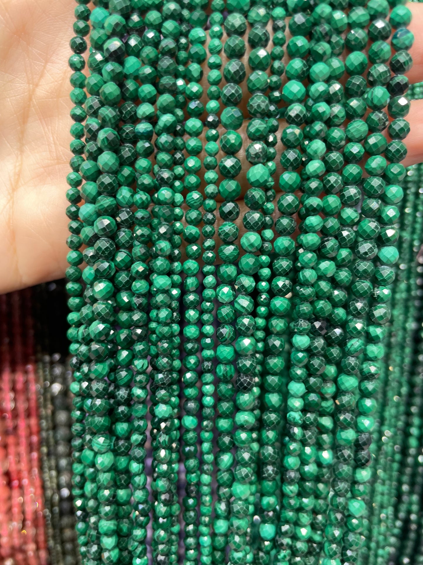 faceted natural malachite strand