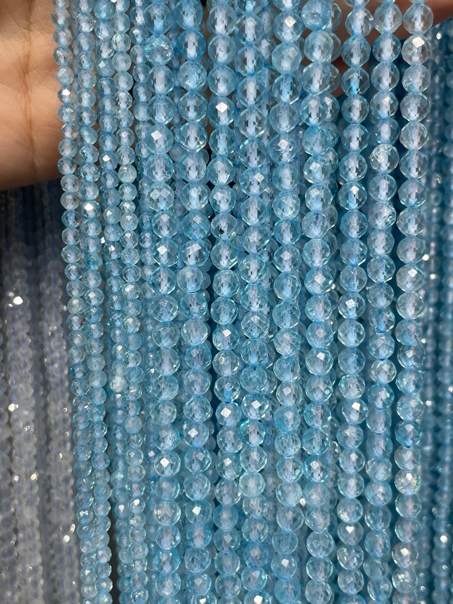faceted blue topaz strand