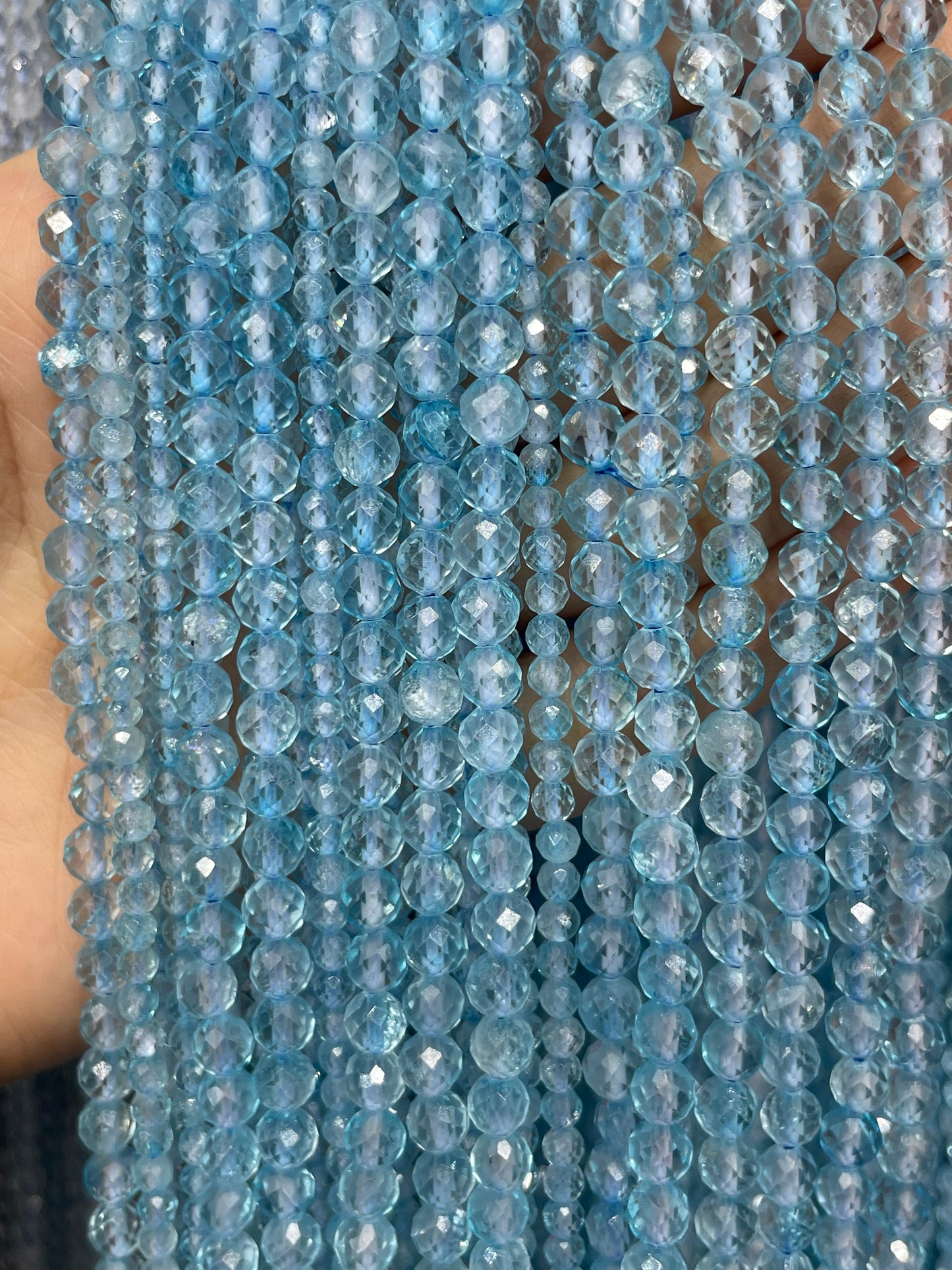 faceted blue topaz strand