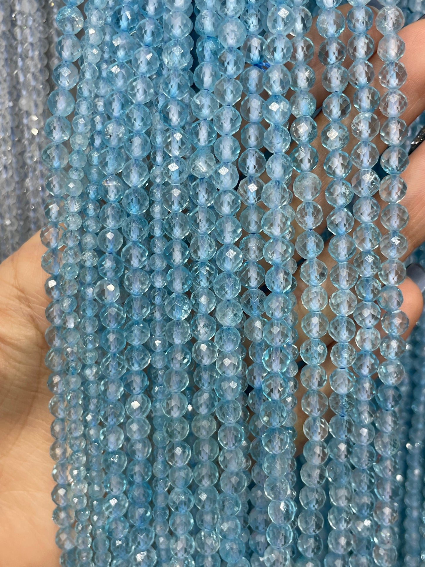 faceted blue topaz strand