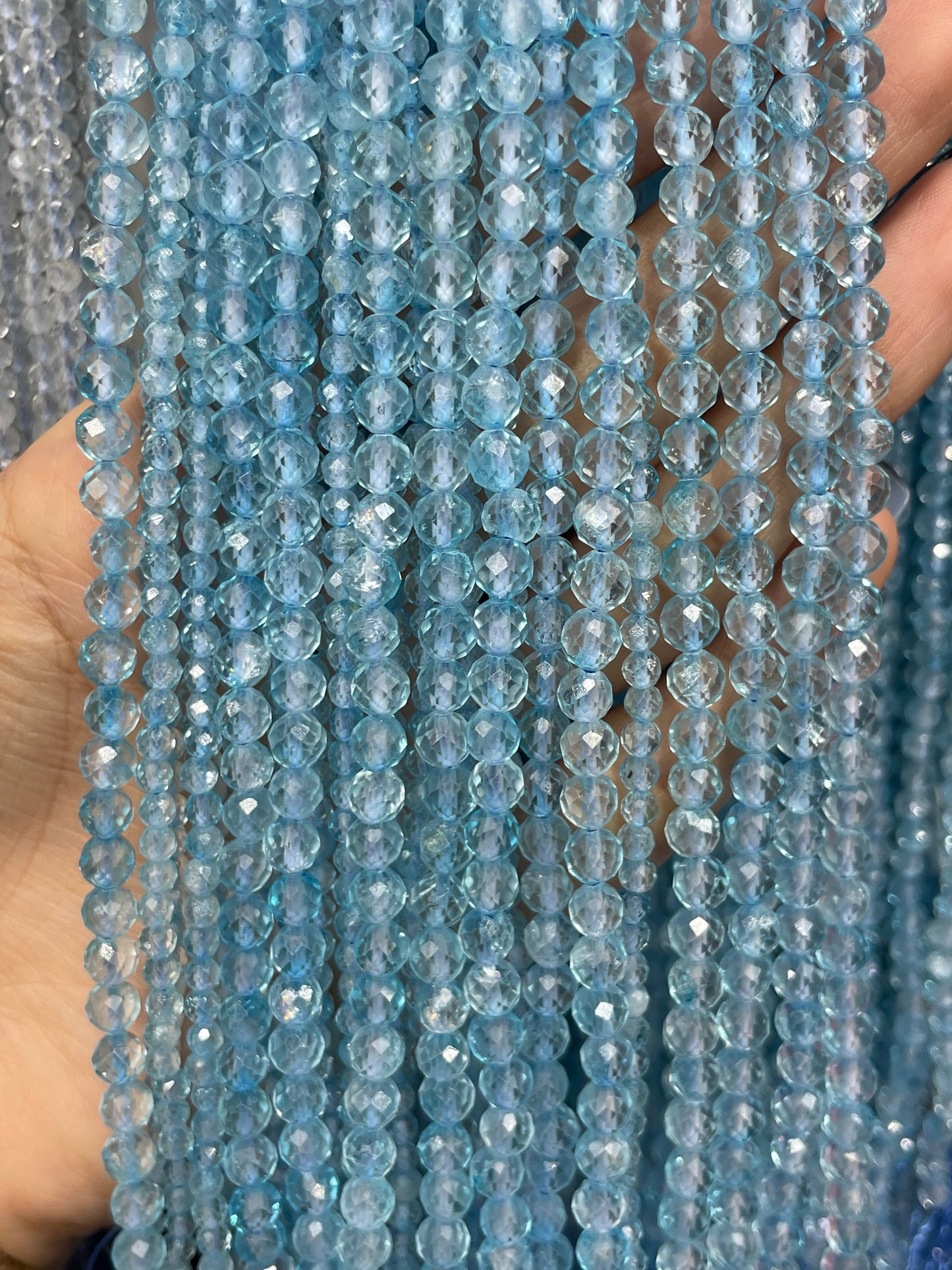 faceted blue topaz strand