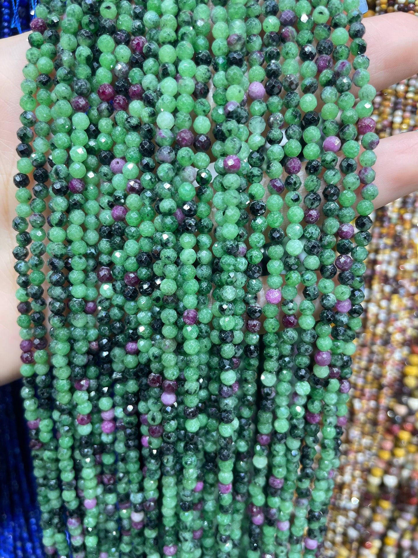 faceted ruby in zoisite strand 3mm
