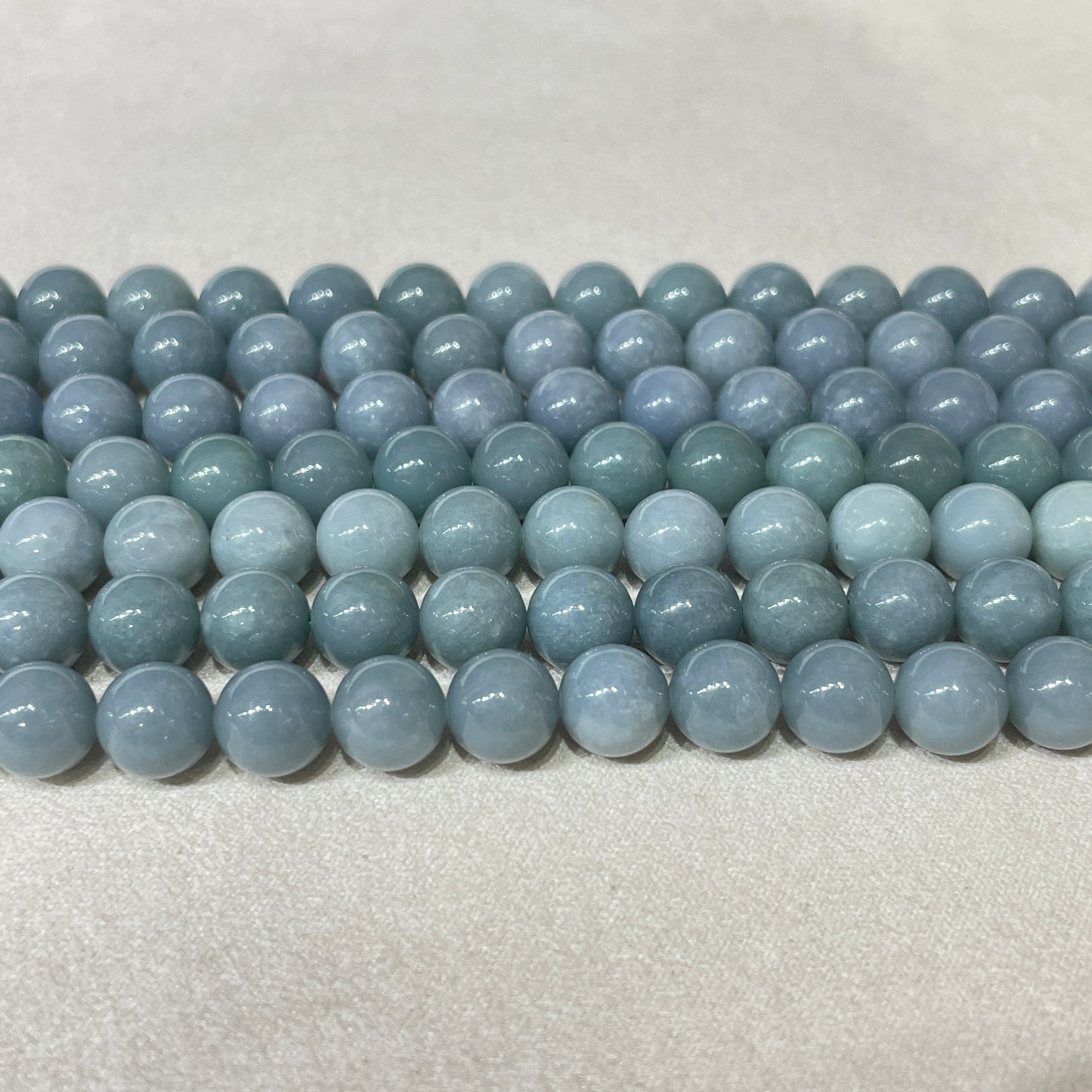 blue water jadelite strands 8.5mm